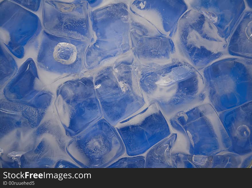 Frozen ice cubes on a blue background