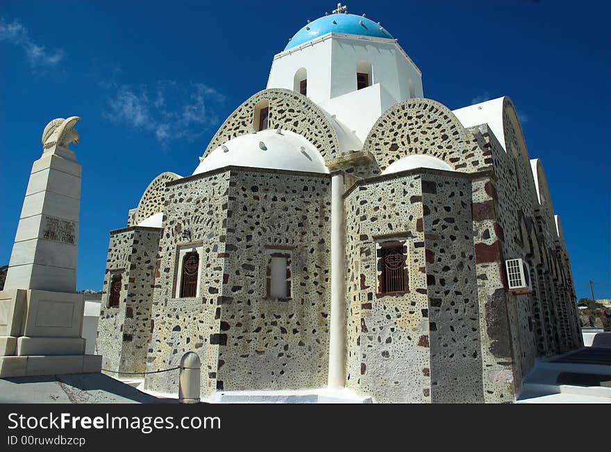 Old church and monument in sunny Santorini