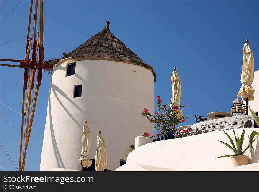 Old windmill beside a restaurant in Santorini