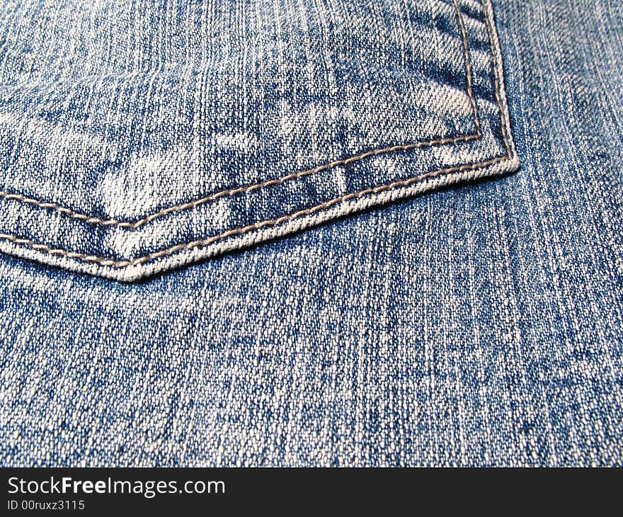 Detail of a pocket in a blue jeans