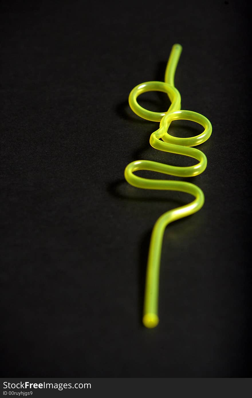 A yellow bendy straw in the studio