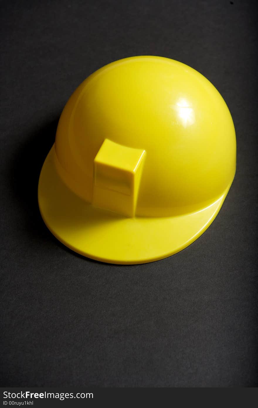 A yellow Hard Hat in the studio