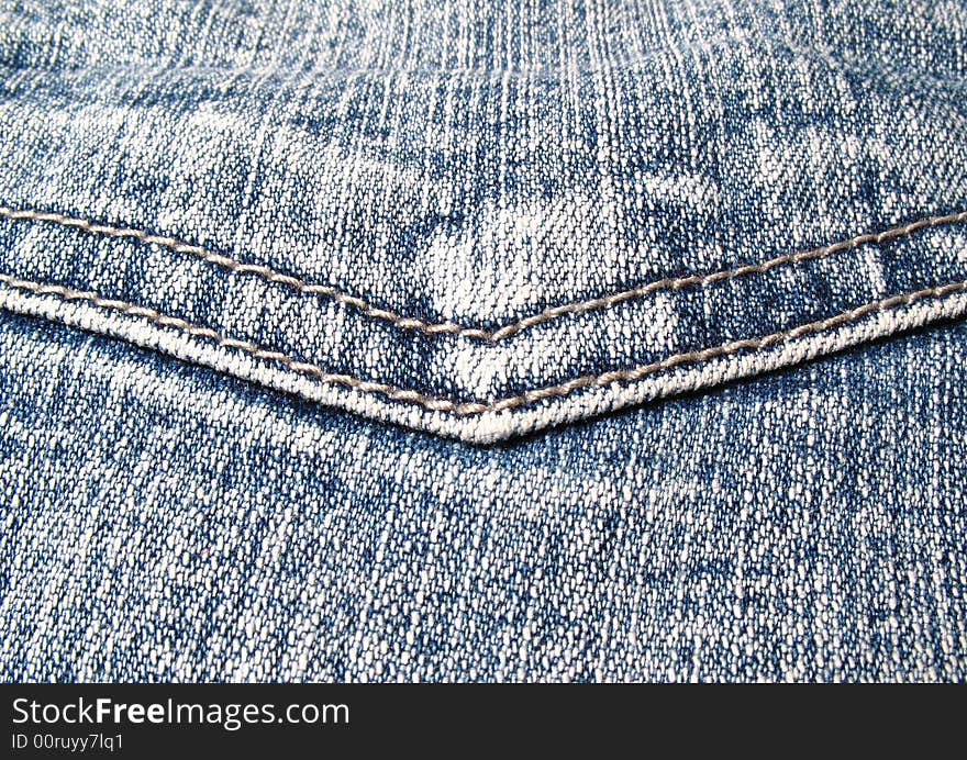 Detail of a pocket in a blue jeans