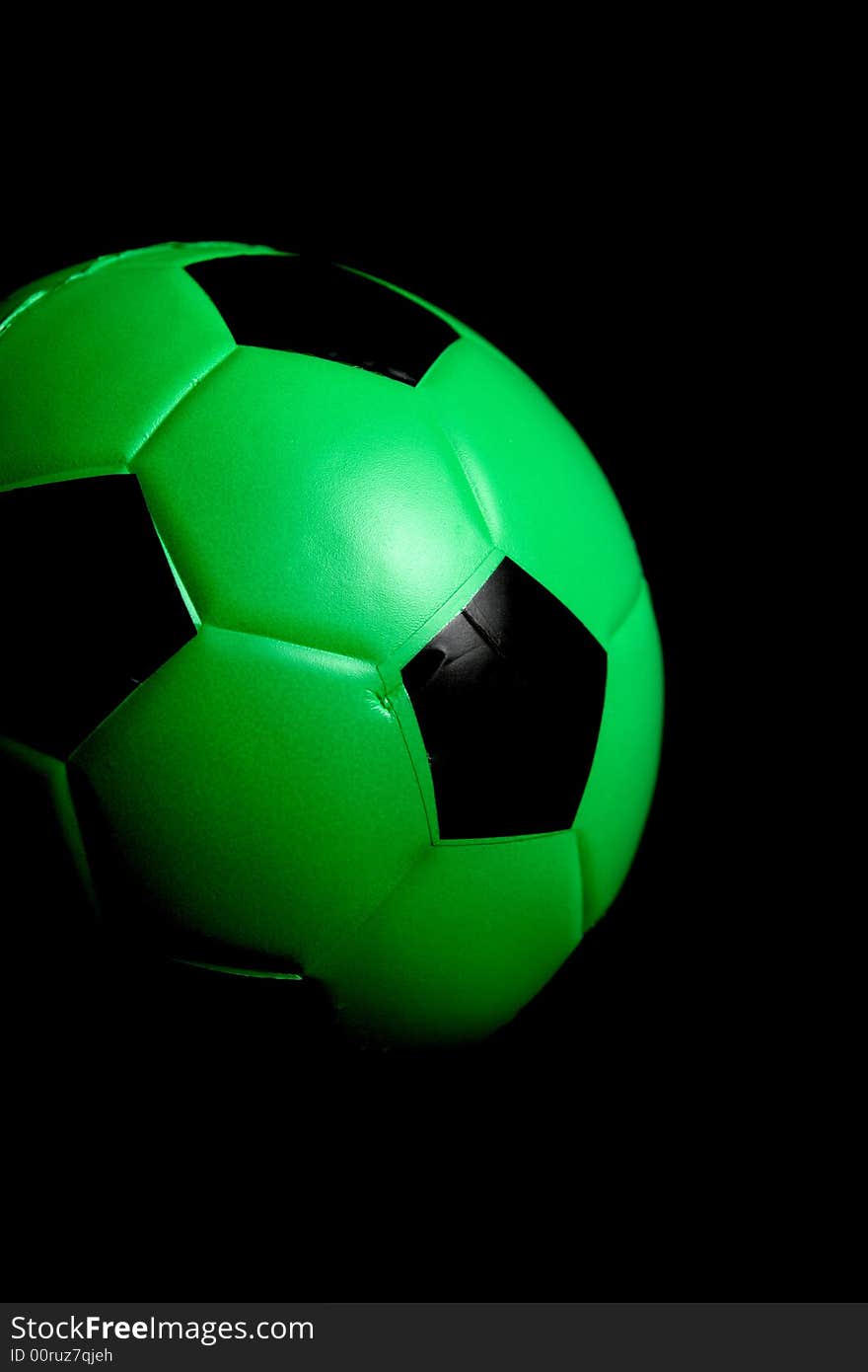 A green Soccer ball in the studio