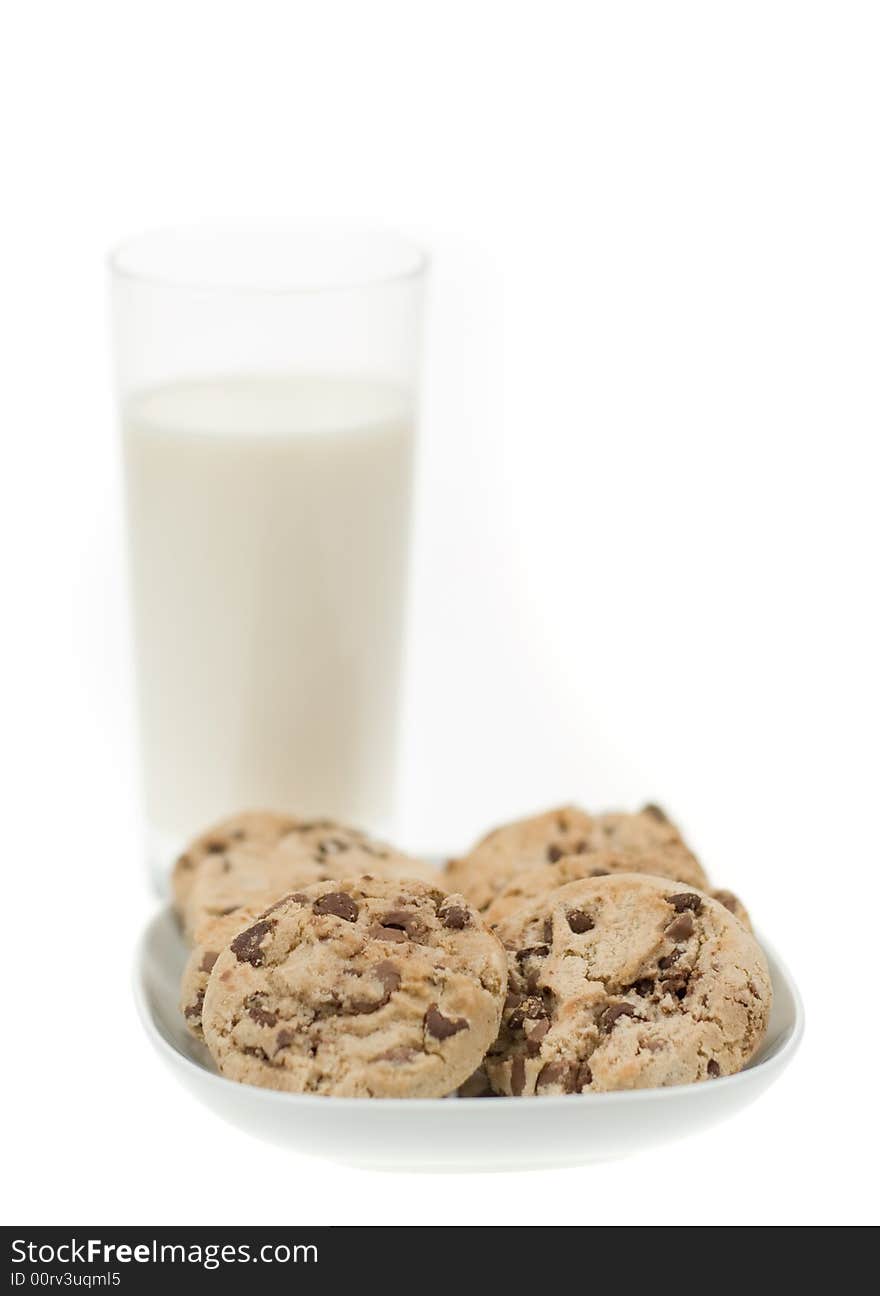 Delicious chocolate chip cookies and glass of milk isolated on a white background