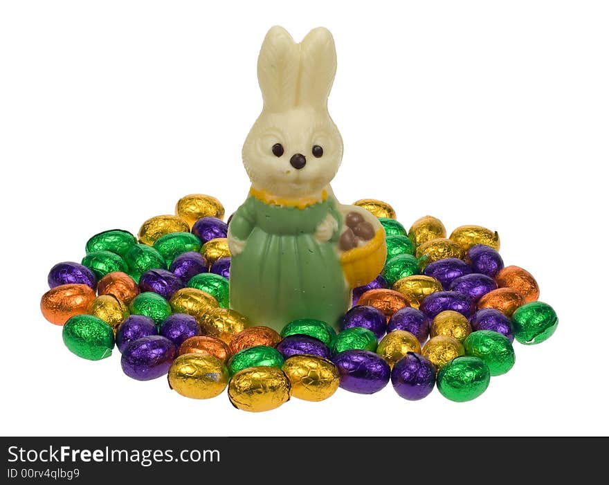 Cute easter bunny surrounded by easter eggs isolated on a white background