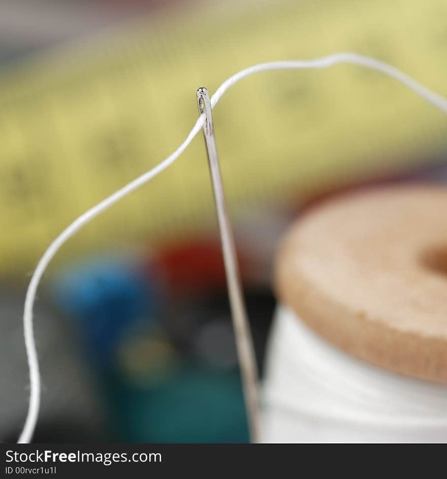 Needle and a thread. A set of accessories for sewing.