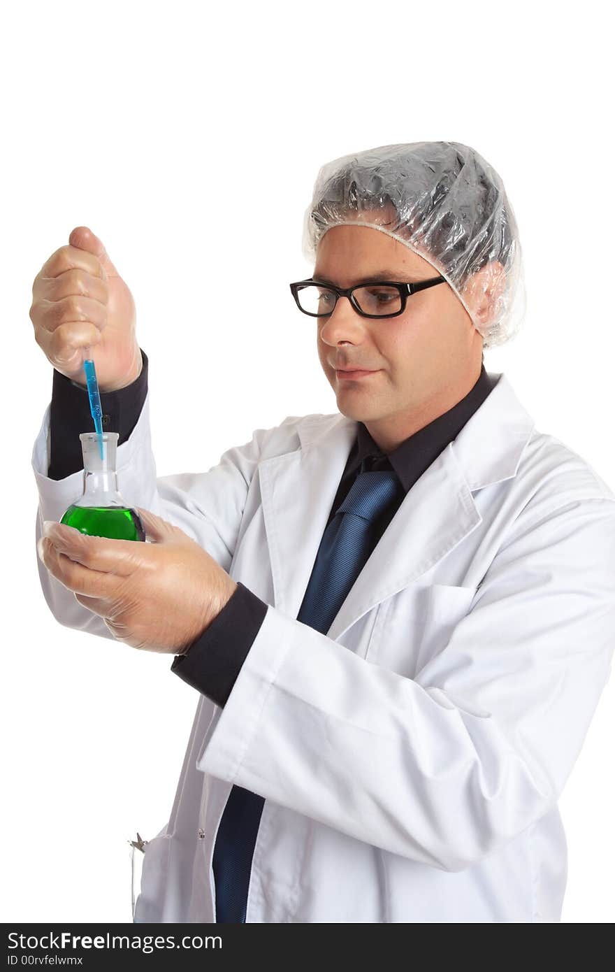 Scientist in the laboratory using a pipette to add a laboratory reagent or sample to a round flask of solution. Scientist in the laboratory using a pipette to add a laboratory reagent or sample to a round flask of solution.