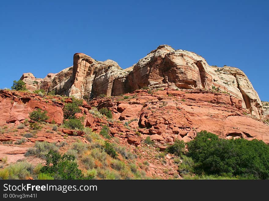 View of the red rock formations in Capitol Reef National Park with blue sky�s and clouds. View of the red rock formations in Capitol Reef National Park with blue sky�s and clouds