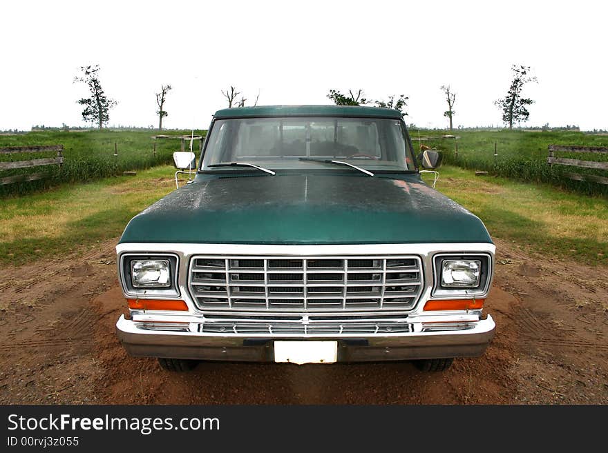 An old truck drive down a back road. An old truck drive down a back road