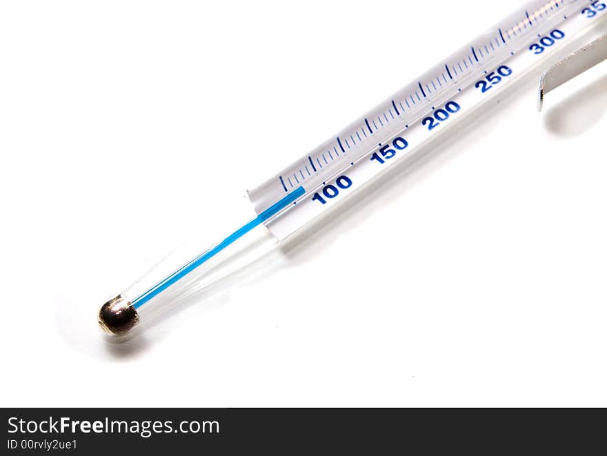 A glass mercury thermometer on white seamless background. A glass mercury thermometer on white seamless background.