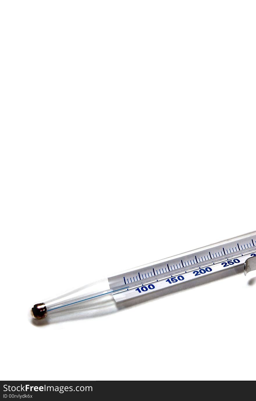 A glass mercury thermometer on white seamless background. A glass mercury thermometer on white seamless background.