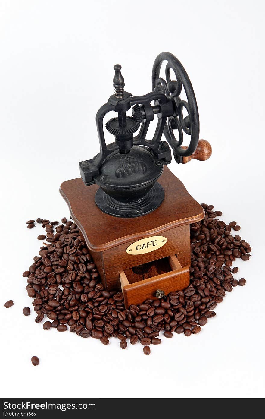 Coffee-grinder with coffee bins on white background.