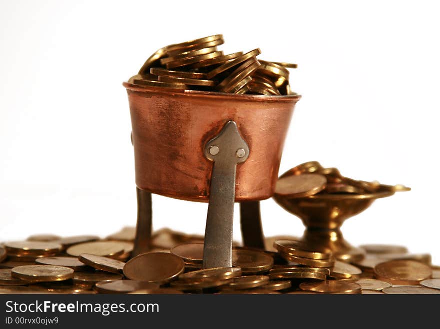 Image with many coins in two cups, and around them, symbolizing richness. Image with many coins in two cups, and around them, symbolizing richness.