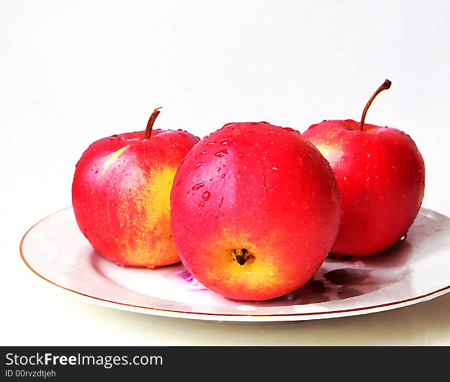 Red apples on a plate