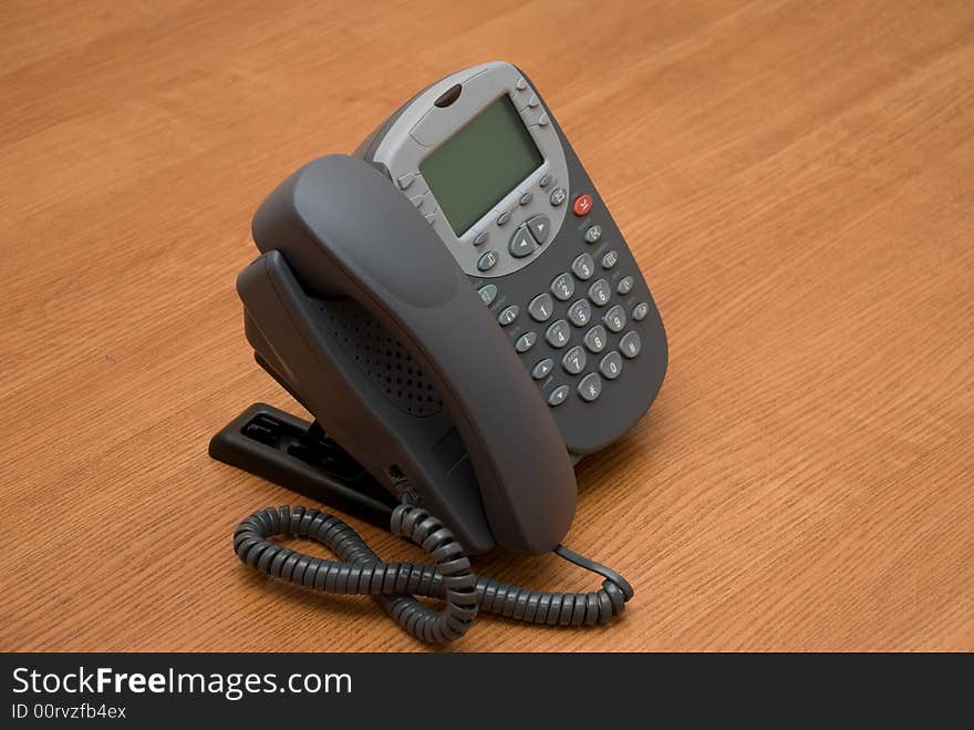 Modern digital phone on the table. Modern digital phone on the table