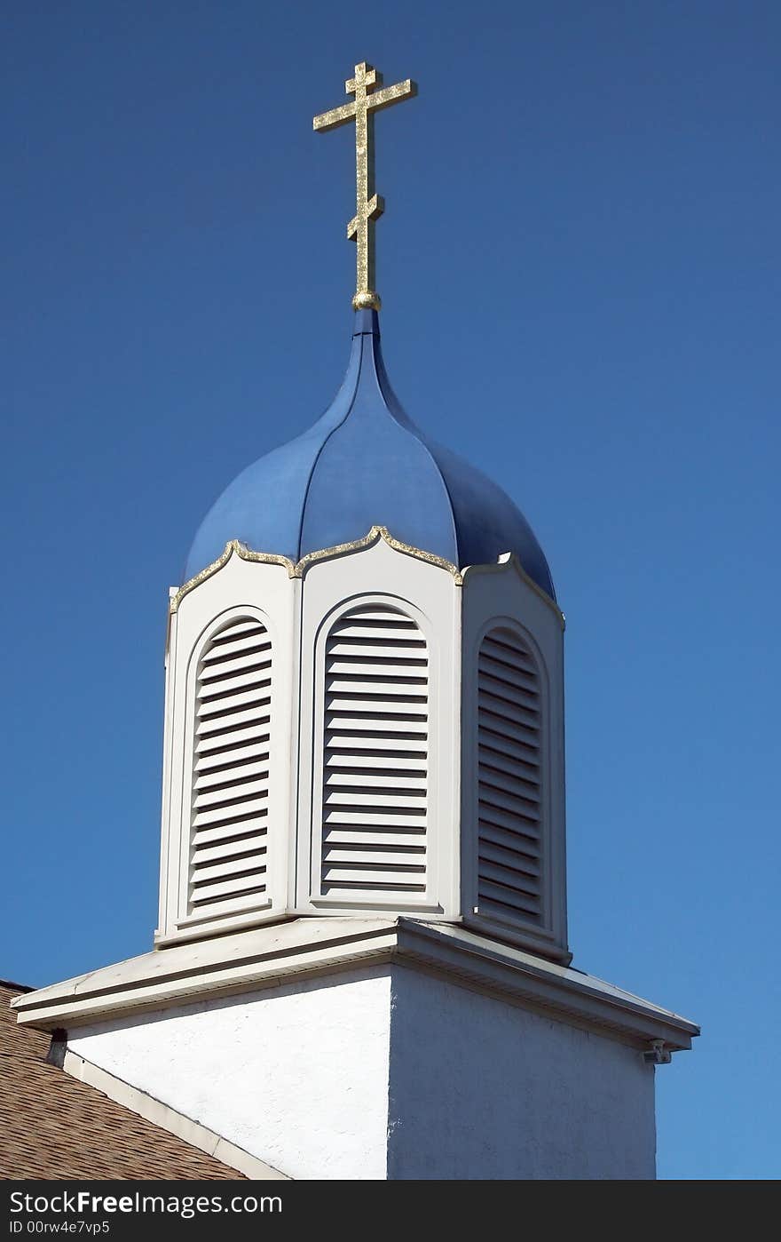 Church Steeple Against A Blue Sky