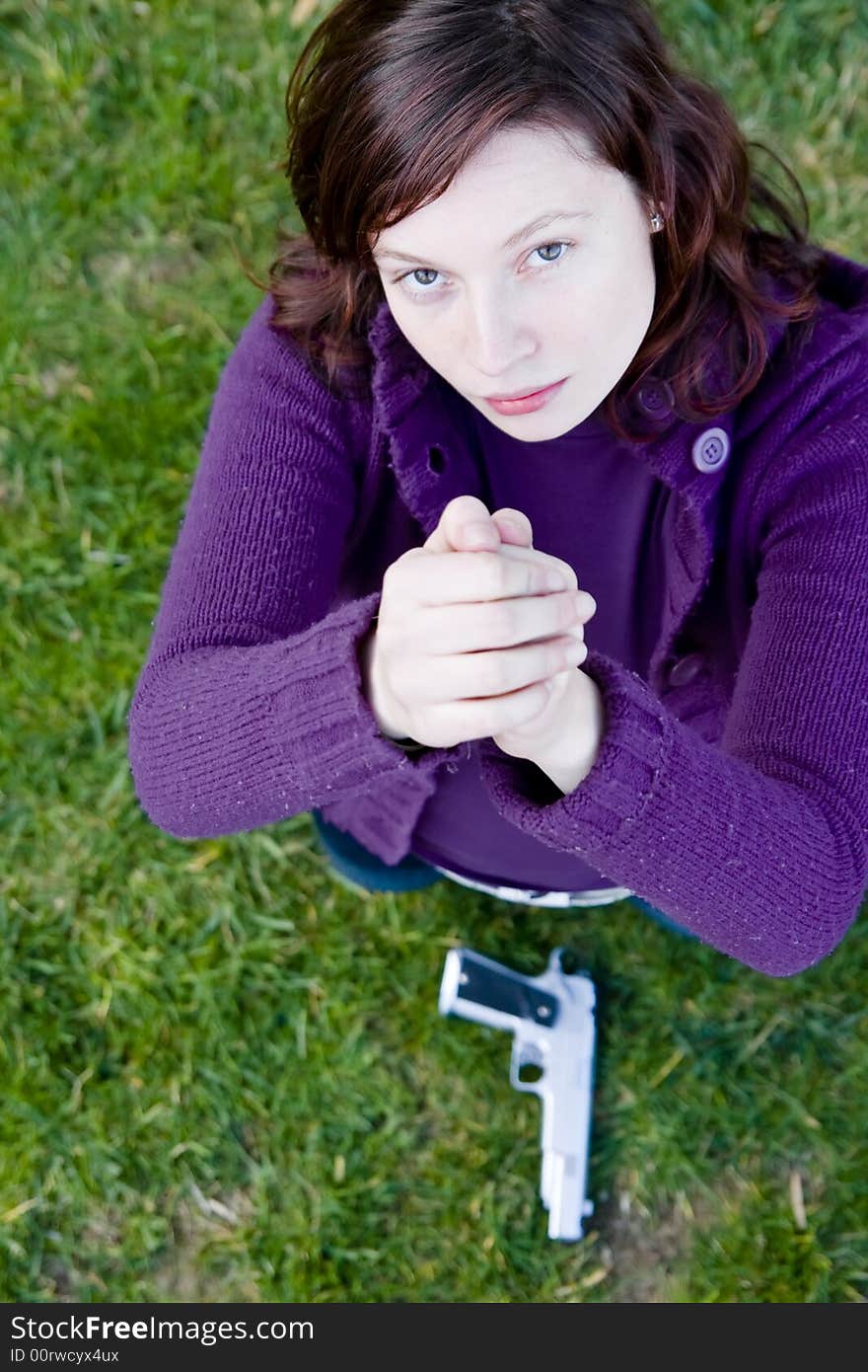 Defeated woman begging mercy in grass background