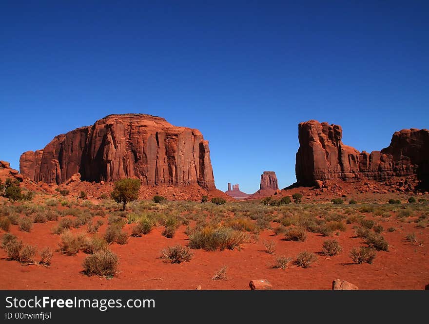 View of the red rock formations in Monument Valley with blue sky�s