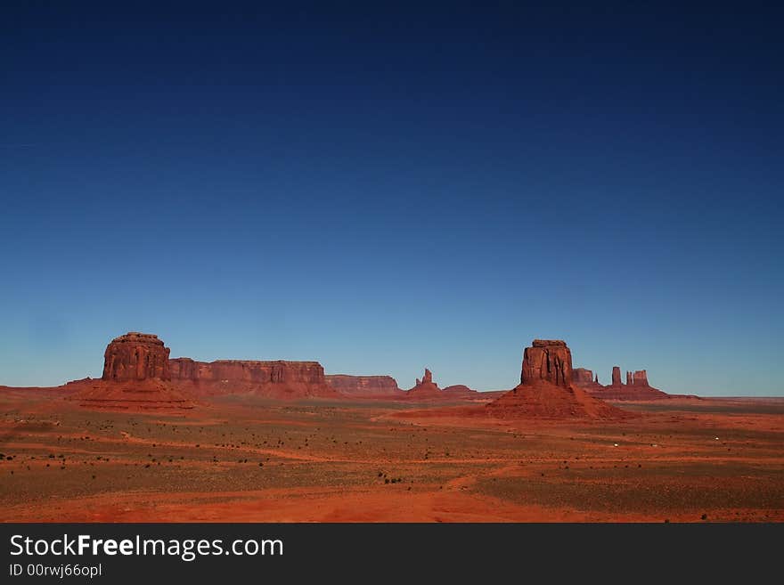 View of the red rock formations in Monument Valley with blue sky�s