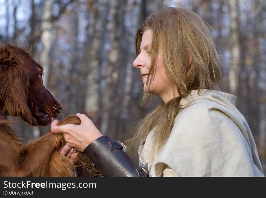 Portrait of the girl and irish setter in autumn forest. Portrait of the girl and irish setter in autumn forest.