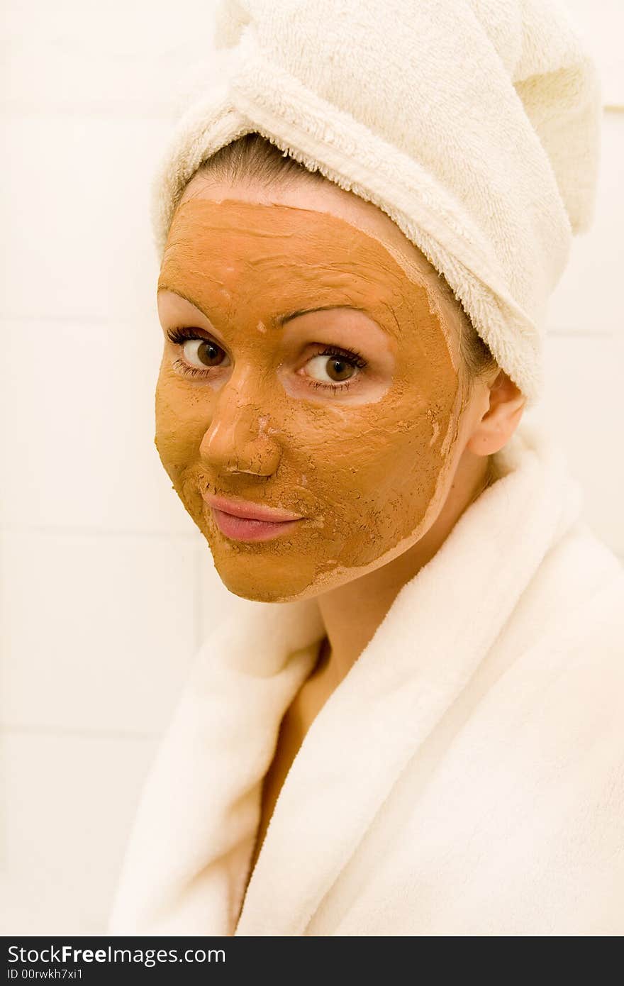 Beautiful woman wearing a skin mask. Beautiful woman wearing a skin mask