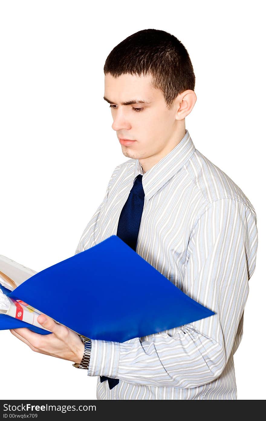 The young man in a striped shirt reads documents in a  blue folder. The young man in a striped shirt reads documents in a  blue folder