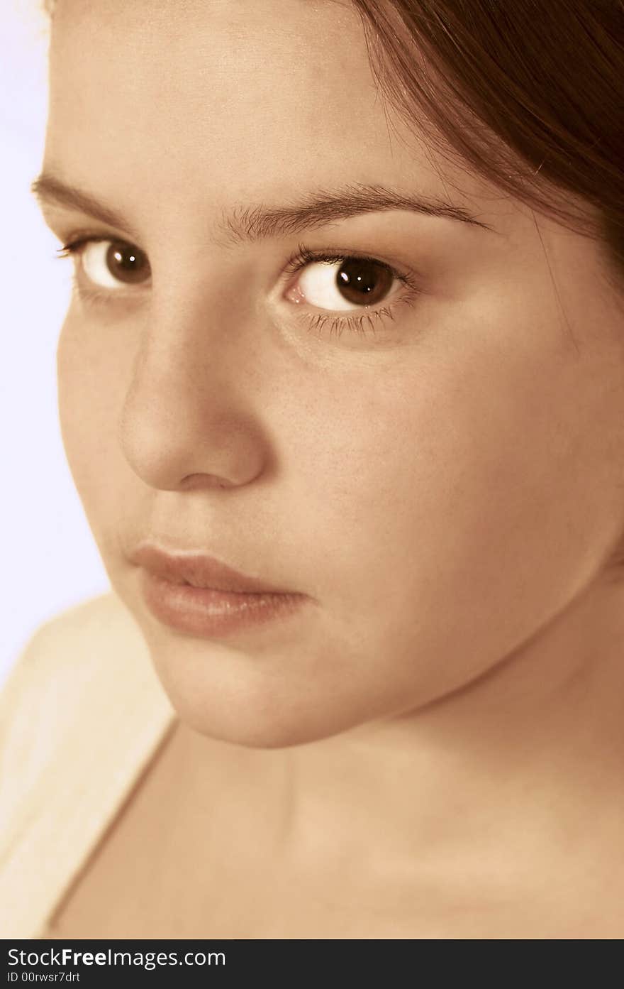 Portrait of the beautiful girl on a blue background