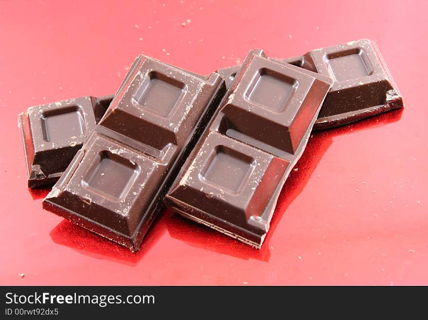 Chocolate isolated on a red background