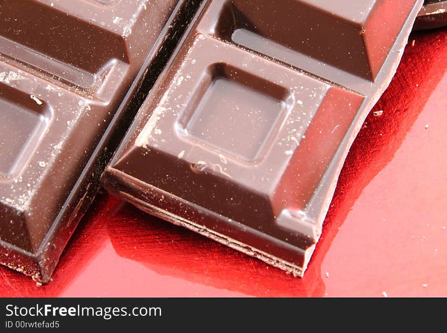 Chocolate isolated on a red background