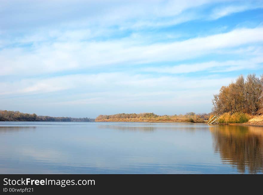 River on plain, water and sky