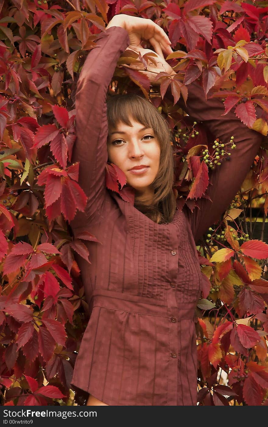 The girl in red leaves