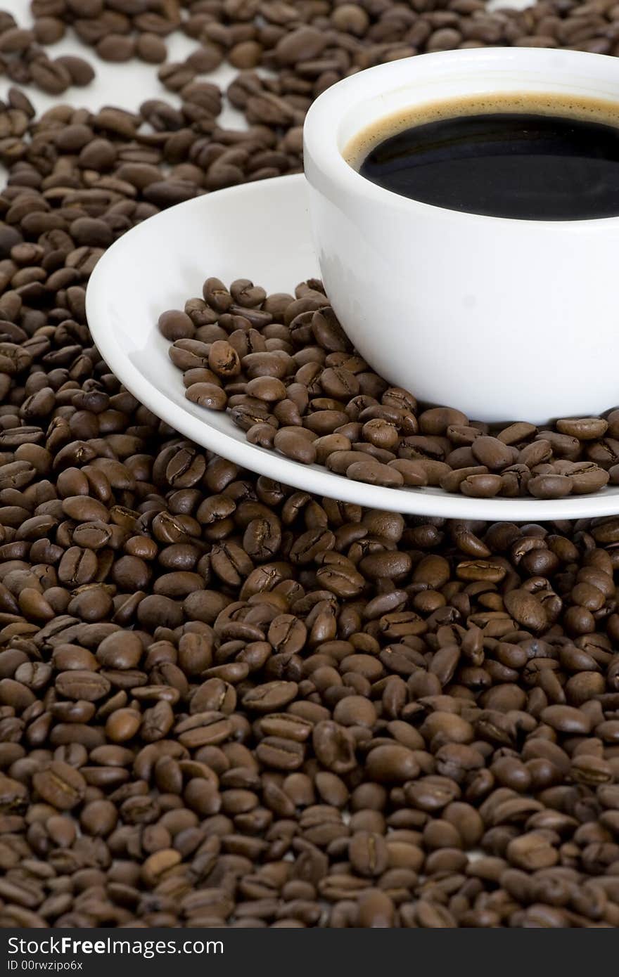 Cup of coffee and coffee beans background. Cup of coffee and coffee beans background