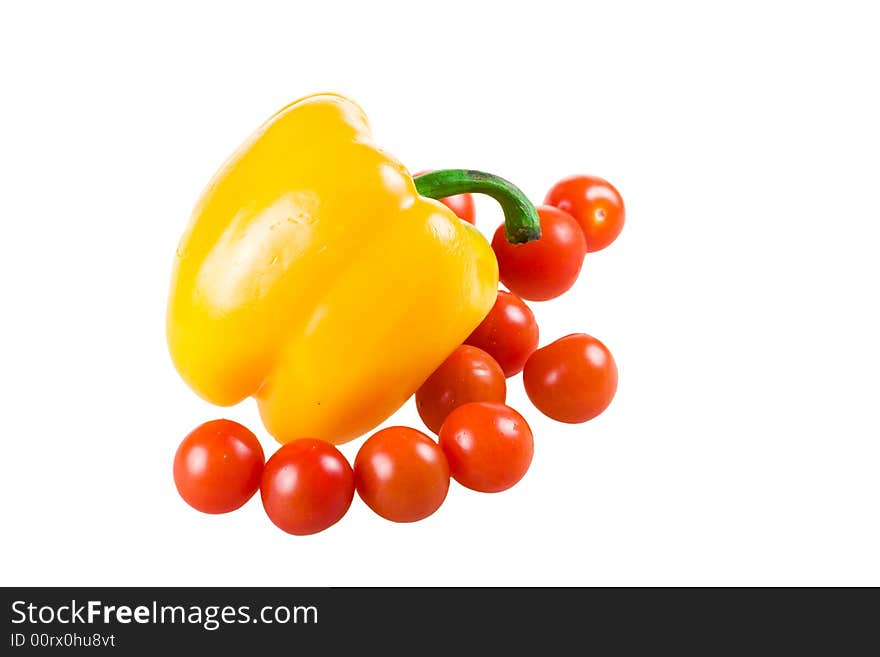 The set of vegetables:Pepper and tomatoes isolated on a white background