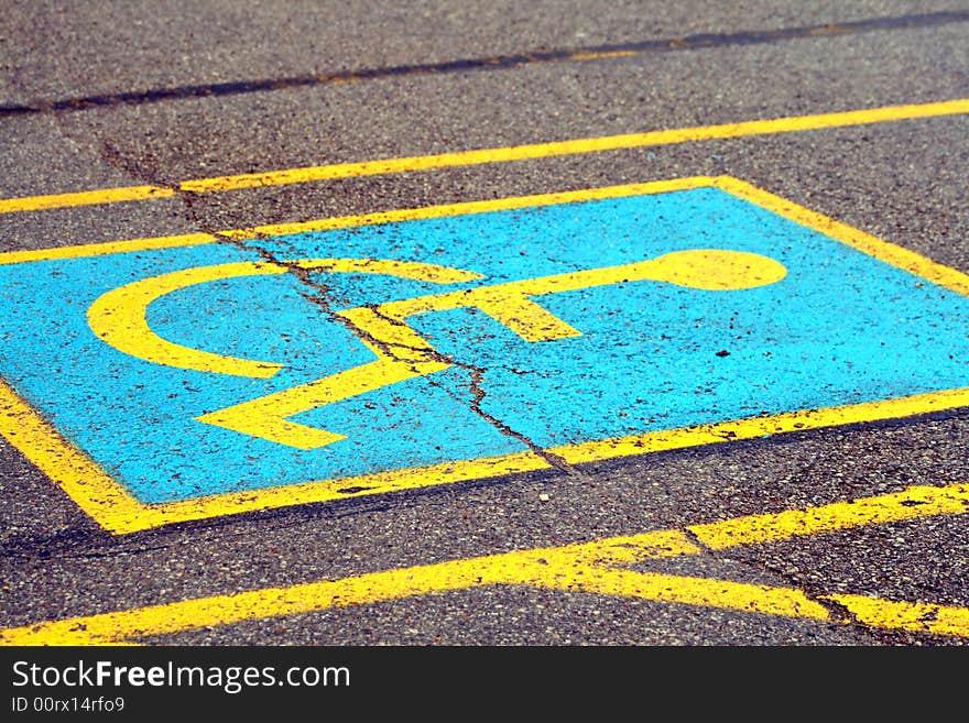 Blue and yellow handicapped parking space