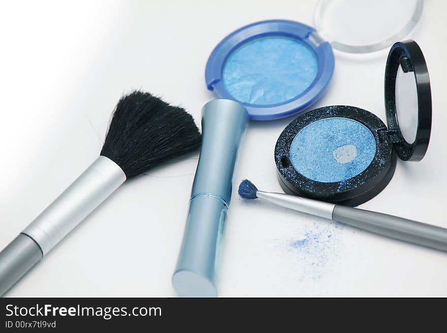 Azure eyeshadows and brushes on white