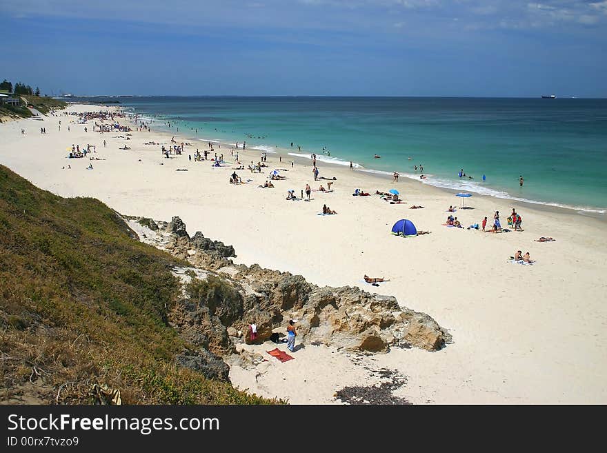 Beautiful sandy beach with many tourists.  Australia. Beautiful sandy beach with many tourists.  Australia.