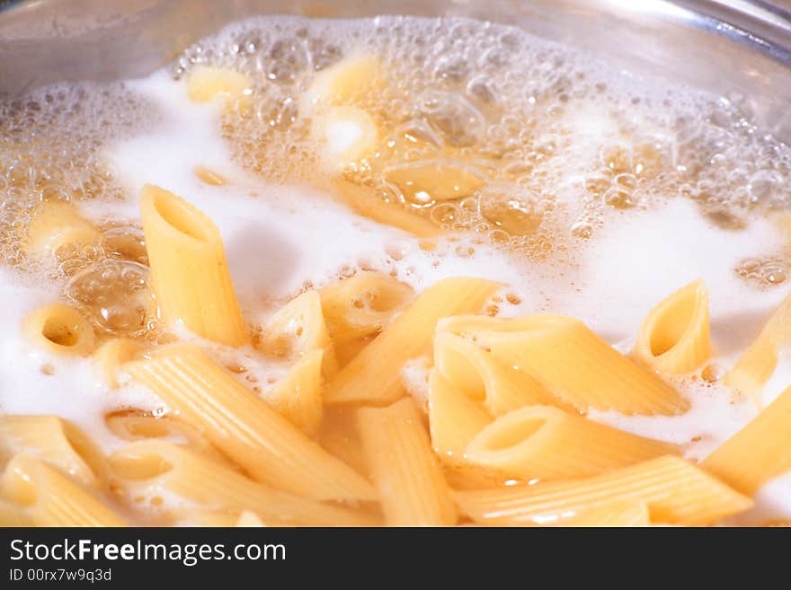 Penne pasta draining