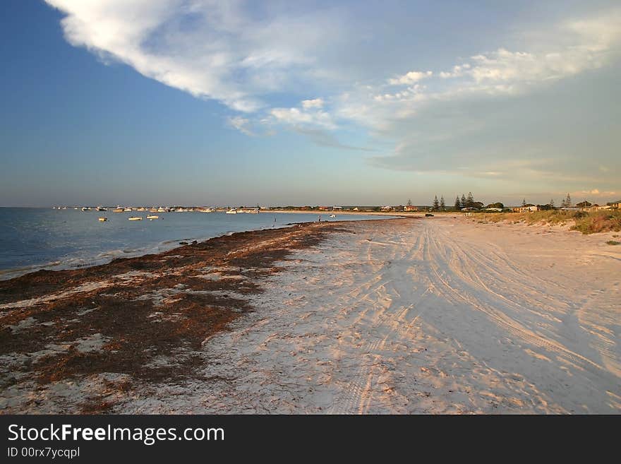 Sandy beach colored with late afternoon sunlight. Australia. Sandy beach colored with late afternoon sunlight. Australia.