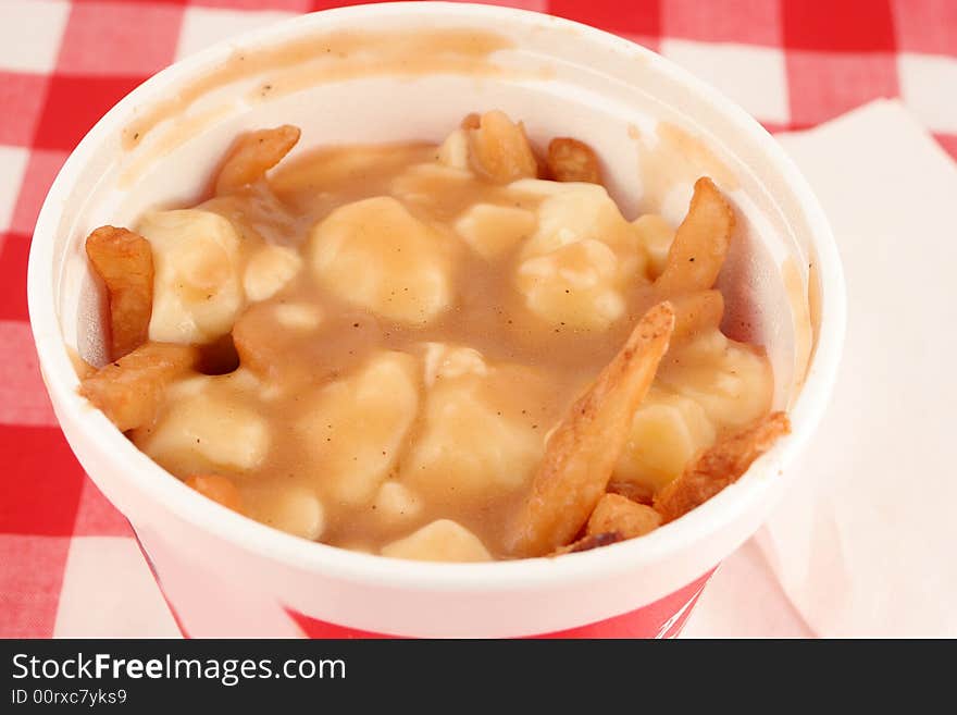 French fries smothered in gravy and melted cheese, also known as poutine