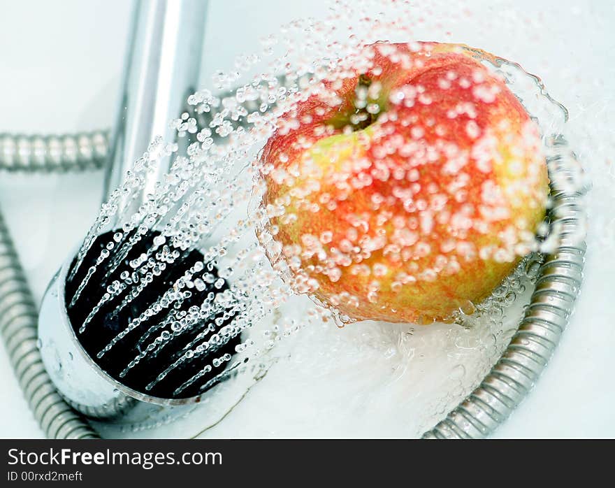 Close-up of an apple, drops and shower