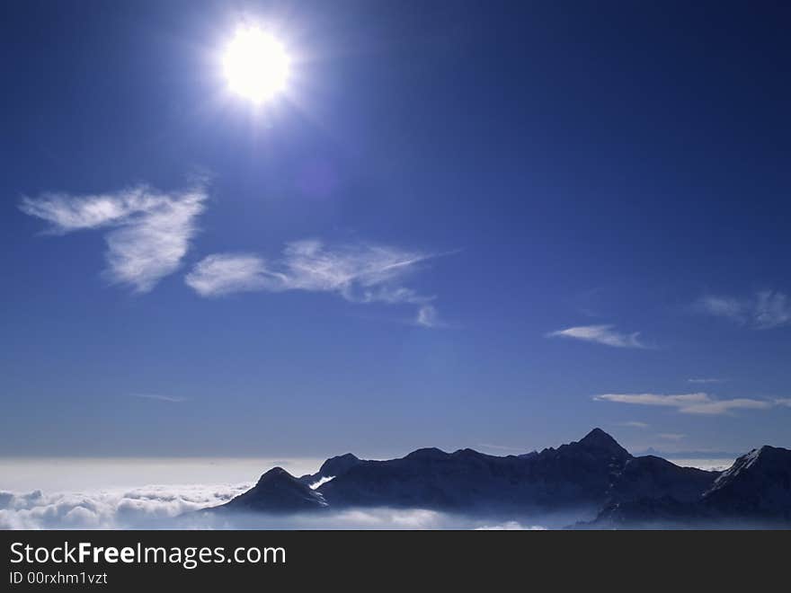 Mountain landscape in back-light; west Alps, Italy. Mountain landscape in back-light; west Alps, Italy