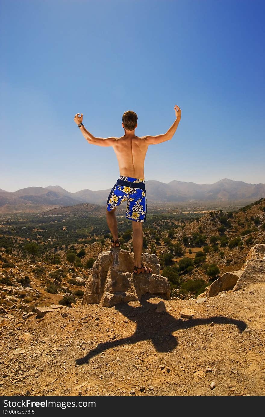 Guy relaxing in mountains