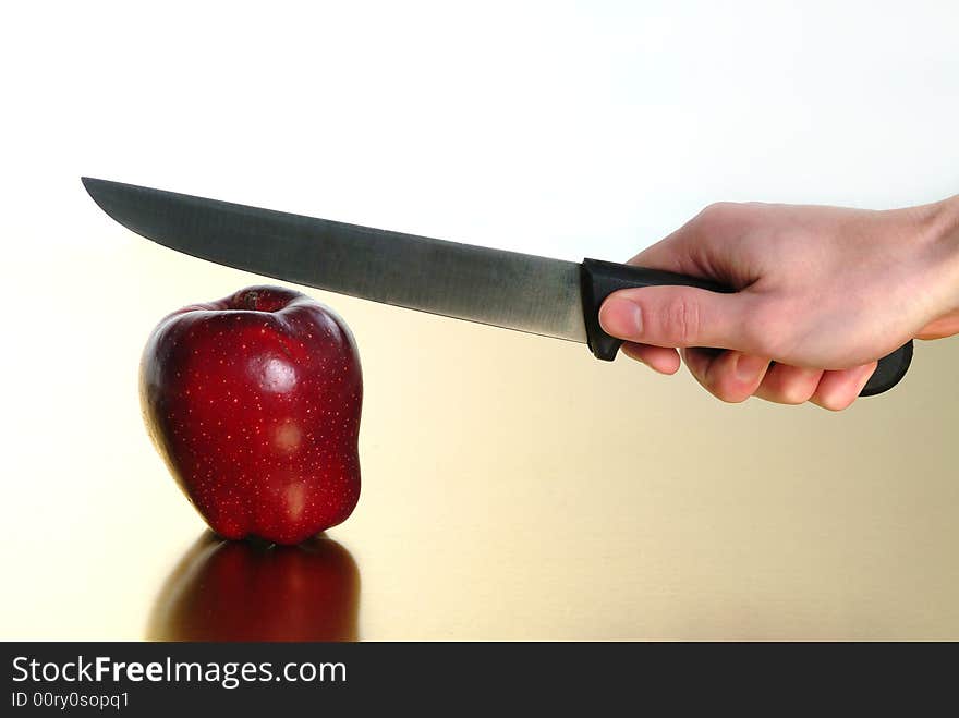 Red apple with golden background