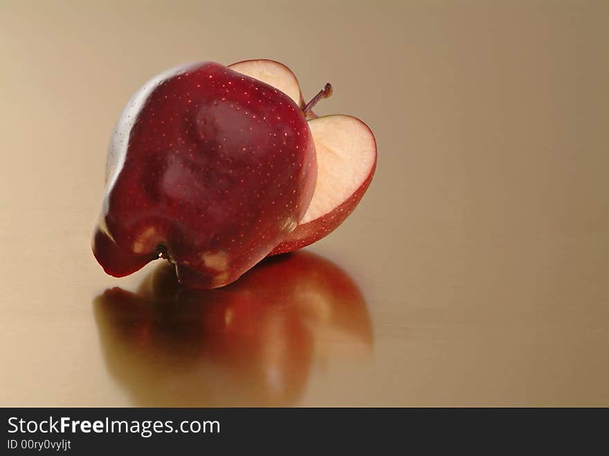 Red apple with golden background