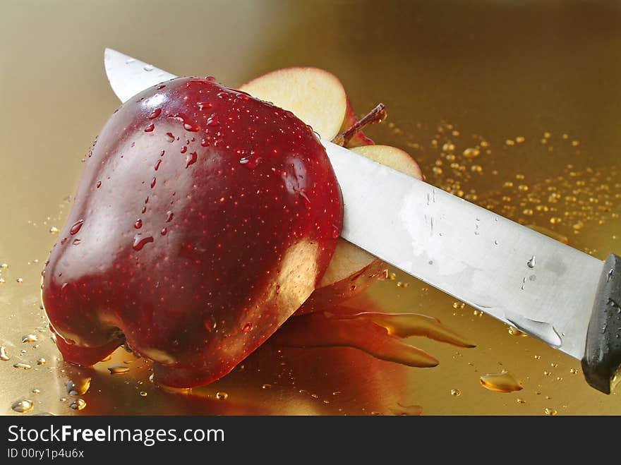 Red apple with golden background