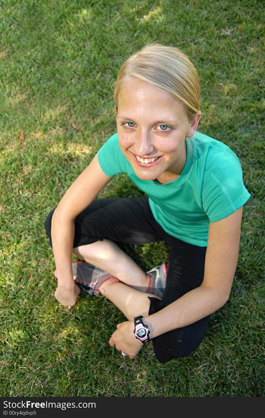 Healthy athletic teenager outside on the grass. Healthy athletic teenager outside on the grass