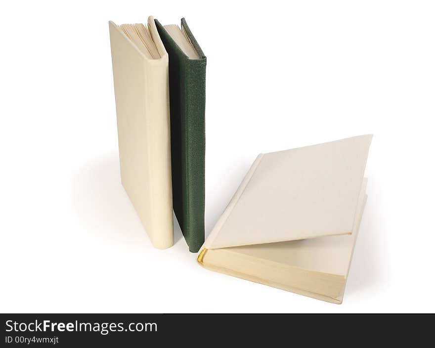 Three hardcover books on white background