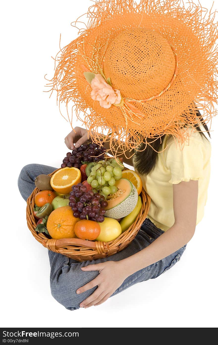 Teenager with fruit basket before white background