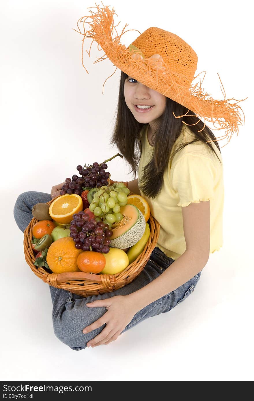 Teenager with fruit basket before white background